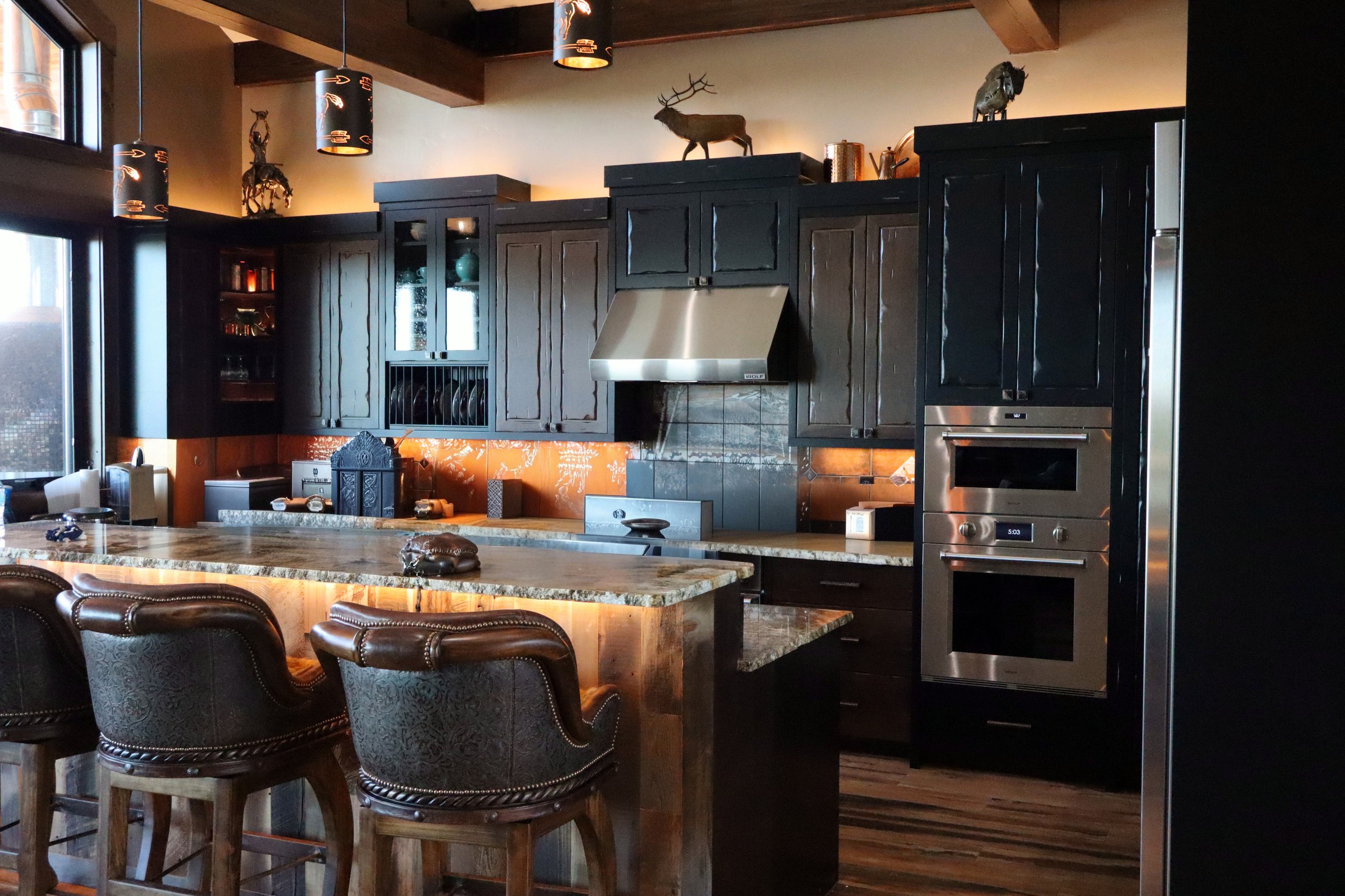 Black distressed kitchen with granite island